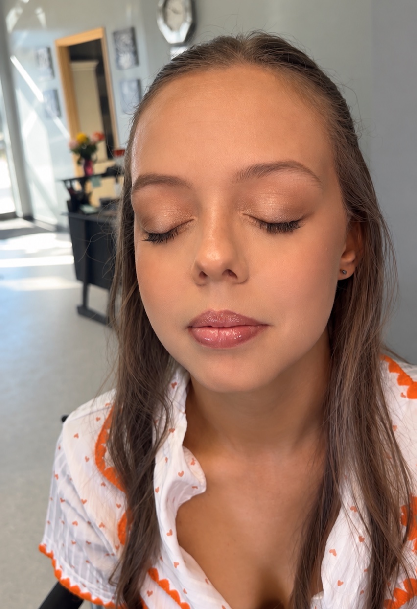 Smoky eye makeup with a glossy deep rose lip